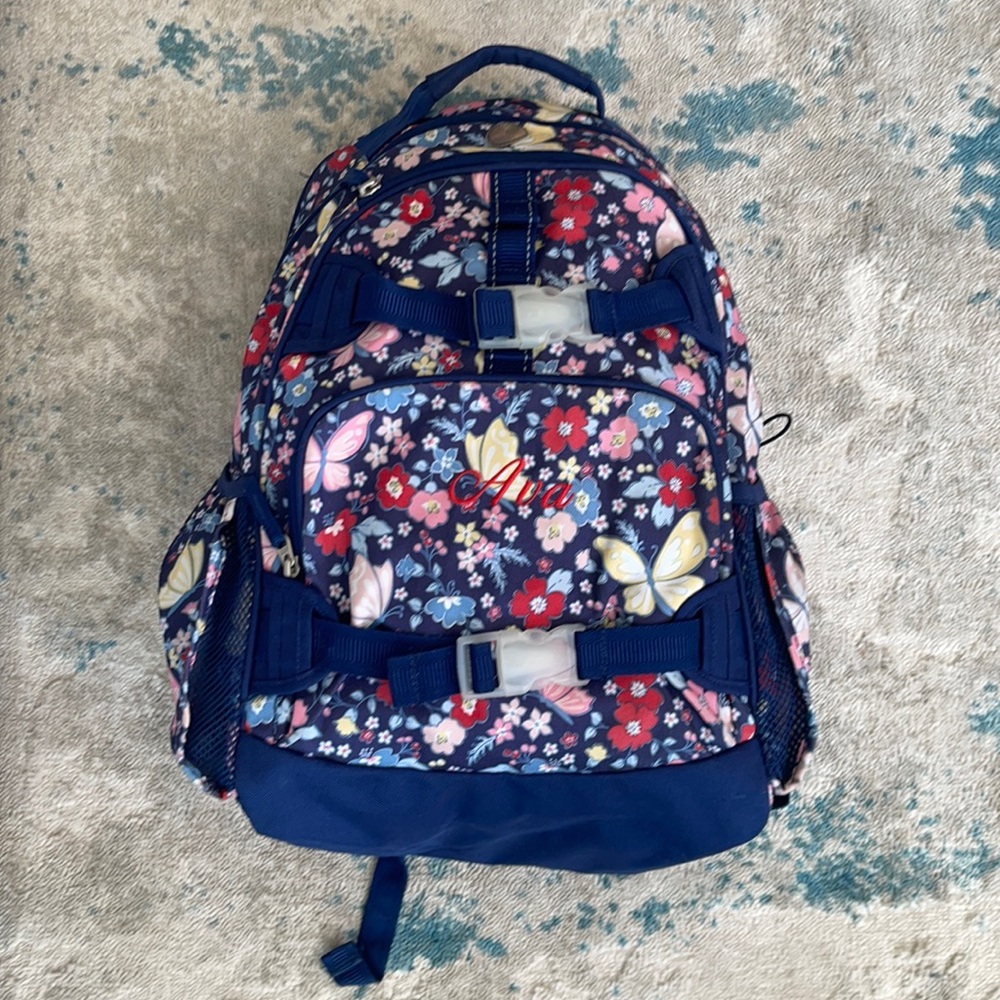 Pottery barn kids back pack with name Ava in RED embroidery.